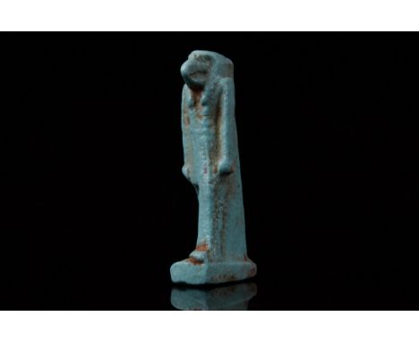 Circa 664-332 BC, Late Dynastic PeriodA light blue faience amulet of the ibis-headed god Thoth with the body of human. A susp