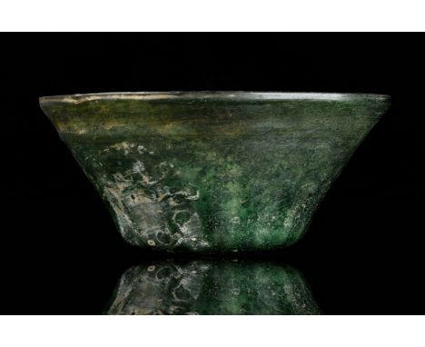 Circa 100-300 ADA well blown ancient Roman green glass bowl, featuring a bulbous globular body tapering to the rim. The inter