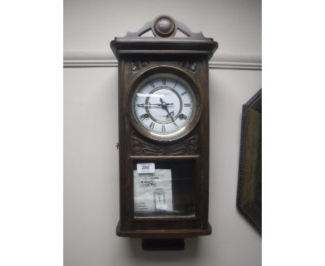 An oak cased President 31 day wall clock