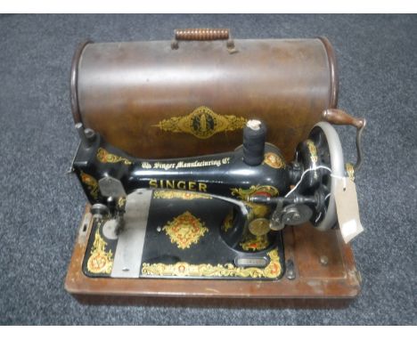 A vintage cased hand Singer sewing machine 