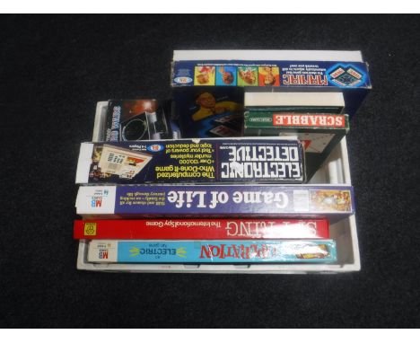 A box of vintage games - Grandstand astro wars, Ideal electronic detective, operation etc 