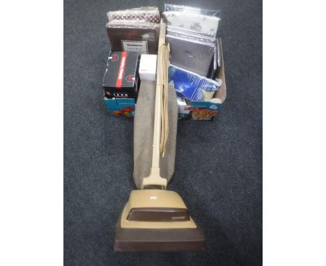 A box of new sealed bedding, vintage Hoover vacuum with hoover bags and accessories, Morphy Richards iron etc 