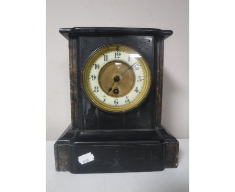 A Victorian slate brass mantel clock with brass and enamelled dial