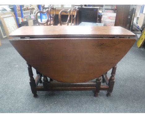 A Victorian oak gate leg table 