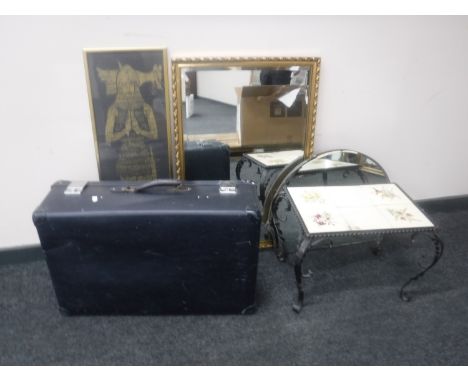 A mid 20th century luggage, Art Deco mirror, print, wrought iron tiled top table and a gilt framed overmantel 