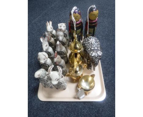 A tray of hardwood and ivory elephant, three piece plated Arabic tea service, ten pottery zodiac figures etc 