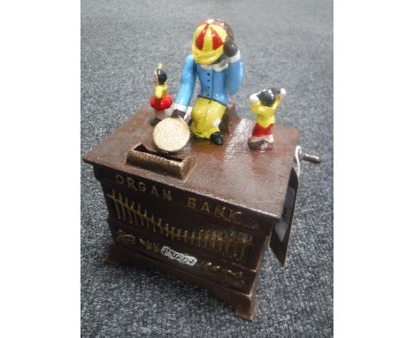 A cast metal organ grinder money box 