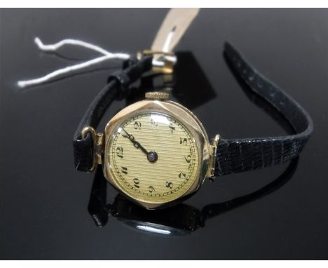 A vintage 9ct gold lady's watch on black leather strap