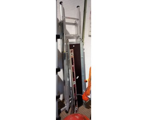 A set of aluminium folding step ladders with platform and a spirit level