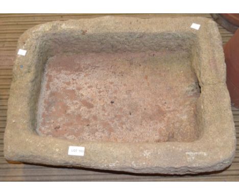 A cast decorative garden trough