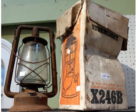 A tilly storm light in original box with an older example
