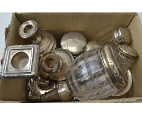 A quantity of assorted silver items, includes, candlesticks, silver lidded cut glass jars, a caddy spoon, a niello silver nap