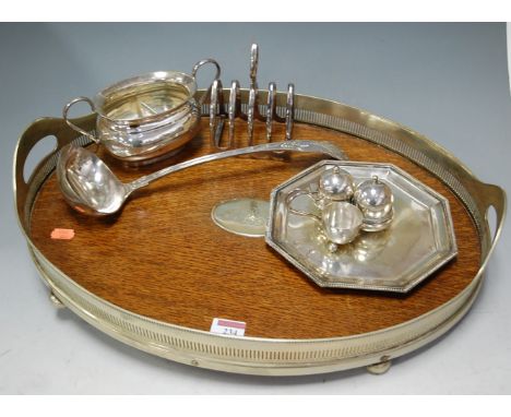 An early 20th century oak and silver plated twin handled gallery tray; together with a silver plated  three-piece cruet, and 