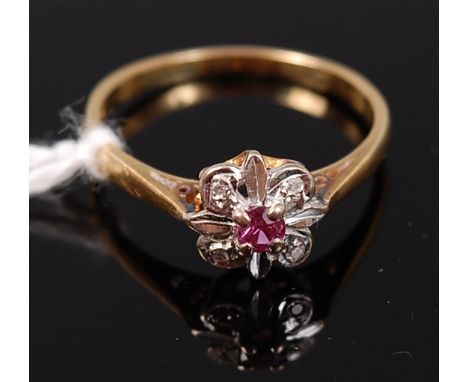 An 18ct gold, ruby and diamond point set flower head dress ring, 2.9g, size P