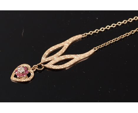 A modern 9ct gold necklace set with heart shaped ruby and diamond point pendant, 4.3g, pendant height 10mm