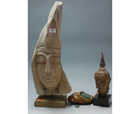 A New Zealand South Island Maori jade pendant; together with a carved wooden bust; and one other (3) 