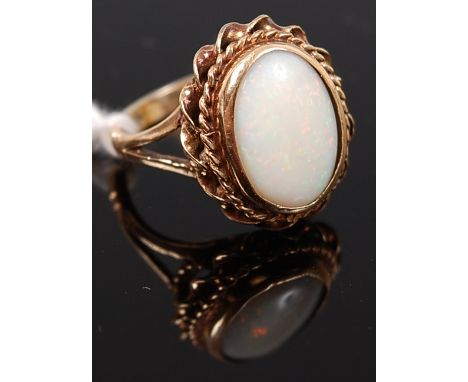 A 9ct gold and cabochon opal set ring, 4.7g, size M