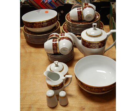 A modern Cahla of Germany eight piece tea and dinner service, on a white ground with burgundy banding and gilt borders