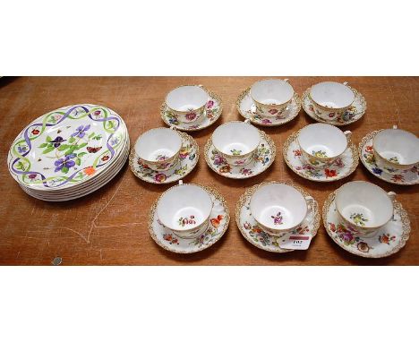 A late 19th century Dresden porcelain part tea service, each piece decorated with floral sprays within gilt heightened border