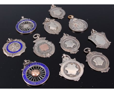Eleven various silver sporting pendant medals, some with enamel or yellow metal inlays, 85g