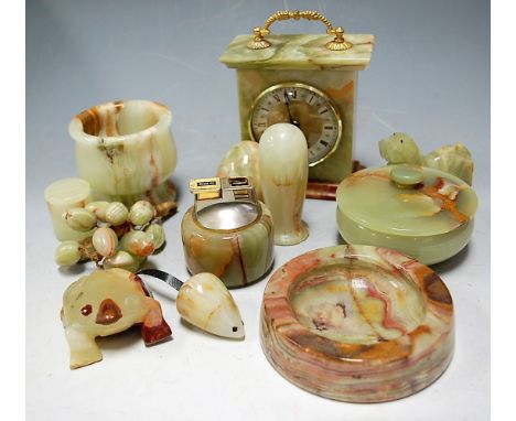 A quantity of circa 1970 onyx wares to include table clock, table lighter, assorted ornaments, etc