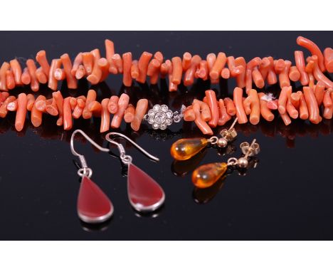 A natural coral single string necklace, with paste set silver clasp; together with a pair of yellow metal and clear orange am