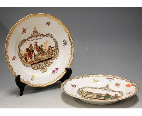 A pair of Meissen porcelain soup bowls, each decorated with historical battle scenes in bright enamels within gilt and floral