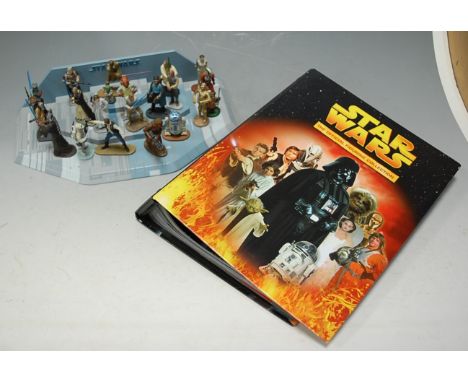 A collection of Star Wars pewter figures from the Lucas films collections by De Agostini, with four platforms and further lit