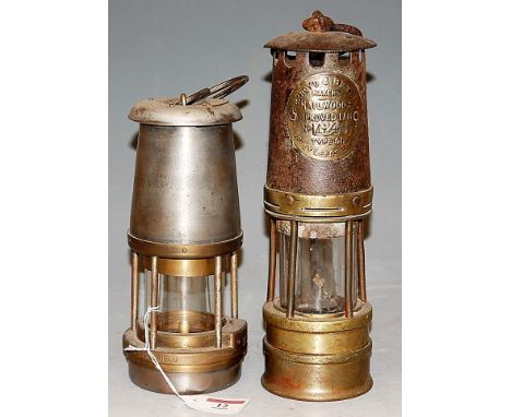 An Ackroyd & Best Ltd brass miner's safety lamp No. 1243, together with one other The Wolf Safety Lamp Company, Wolf Type FS 