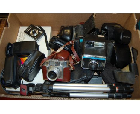 A box of miscellaneous cameras and accessories to include Keystone 60 second Everflash, Pentax MG, camera tripod, Polaroid la