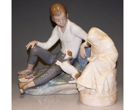 A large Nao figure of a seated child with a puppy, printed mark verso, height 24cm, together with a carved alabaster figure o
