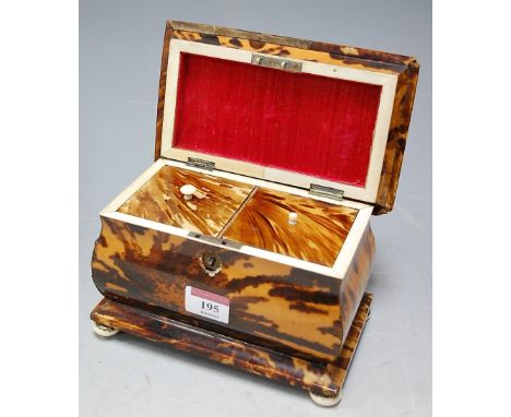 A Victorian tortoiseshell tea caddy of sarcophagus bombe form having white metal dividers, fitted interior with ivory trims, 