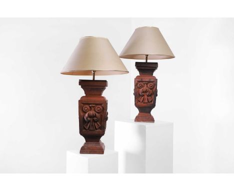 A pair of terracotta table lamps, late 19th/ early 20th century, each of architectural form with moulded foliate detail, with