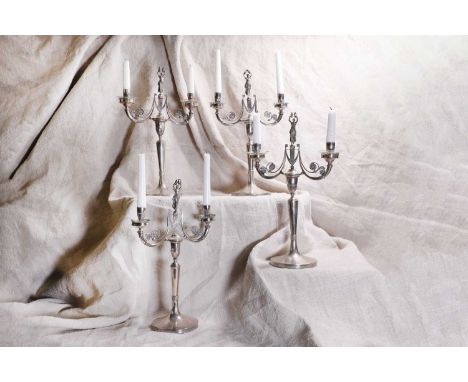 A set of four Italian silver two-branch candelabra, by Fernando Genazzani, Florence, first half of the 20th century, marked w