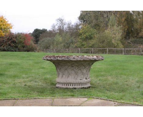 A large reconstituted stone garden urn, the flared neck with a basket weave rim, over a similarly decorated body,101cm diamet