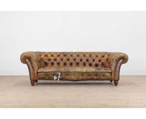A Victorian buttoned leather chesterfield sofa, late 19th century, with studded detail, raised on ring-turned supports,  198c