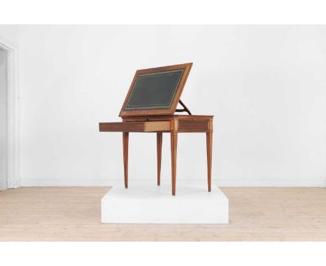 A Directoire mahogany architect's table, c.1800, French, with a leather-lined adjustable top and slides, the long frieze draw