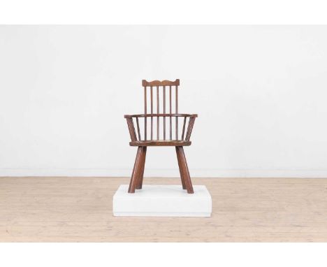 A small elm and oak comb-back Windsor armchair, late 19th/early 20th century and later, 55.5cm wide39cm deep87cm highConditio