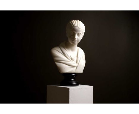 A carved marble bust of Plautilla,  late 18th/early 19th century, Italian, after the antique, raised on a turned wooden socle