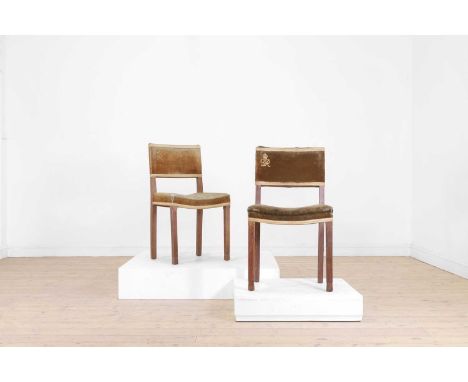 A pair of George VI oak coronation chairs by W Hands & Sons, c.1937, each of typical form with green velvet upholstery and a 