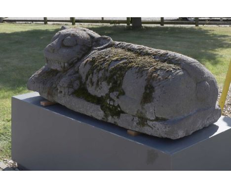 A pair of large carved lavastone Buddhist lions or Barong, 20th century, Indonesian (Javanese), each raised on a metal plinth