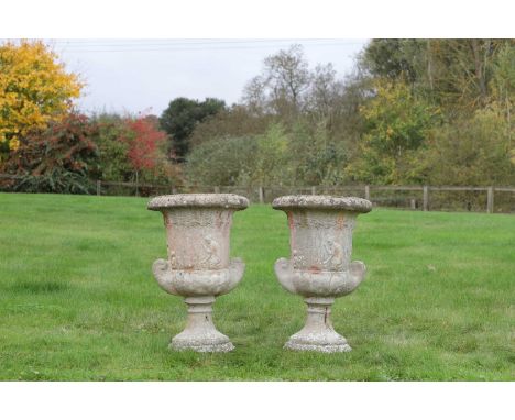 A pair of terracotta garden urns, each of campana form with relief decoration,41cm diameter 62cm high (2)Provenance: The sele