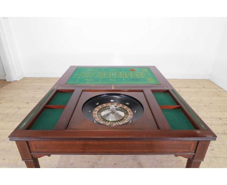 A mahogany and satinwood games table in the Sheraton taste, c.1890, the folding rectangular top enclosing a baize-lined playi