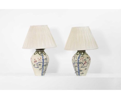 A pair of maiolica table lamps, 20th century, in chinoiserie style, each with a white ground painted with bamboo and cranes, 