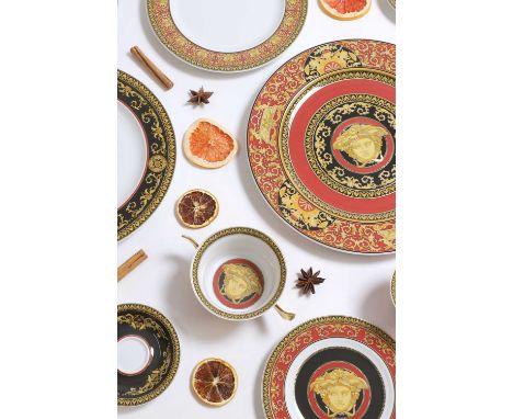 An extensive Rosenthal for Versace porcelain ‘Medusa Red’ dinner service, late 20th century, decorated with baroque-style scr