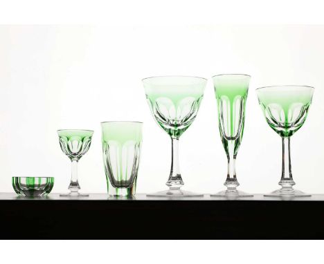 A part suite of Moser 'Lady Hamilton' glasses, 20th century, Czech, each with six shaped ovals to the glass bowls, and decora