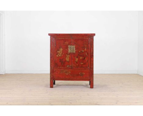 A red-lacquered wooden cabinet, 19th century, Chinese, fitted with two cupboard doors and raised on style feet, the whole dec