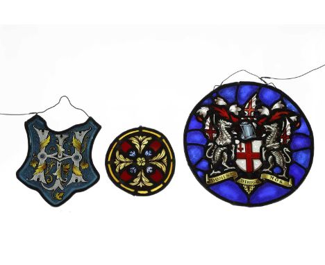 A collection of three stained-glass panels, 19th century, mounted in lead, one example with The City of London coat of arms, 