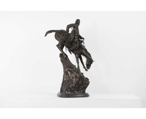 After Frederic Remington,  'The Mountain Man', bronze, impressed 'copyright Frederic Remington', mounted on a black marble ba