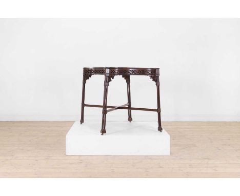 A George III-style mahogany silver table, 19th century, in the Chippendale taste, the serpentine rectangular top with a raise